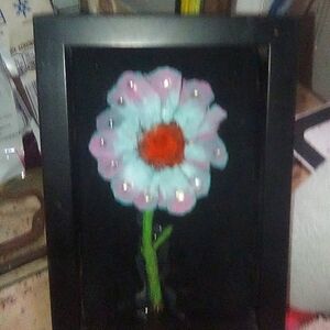 Cute handmade hand painted pinecone daisy simply placed in a small shadowbox.